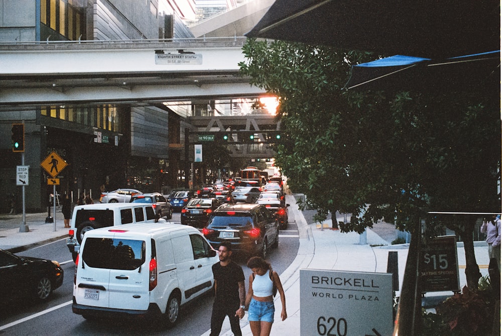 a man and a woman walking down a street