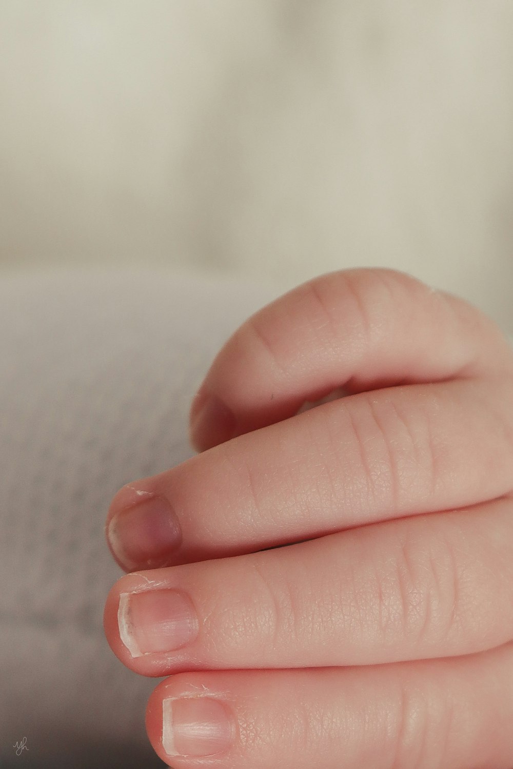 a woman's hand with a ring on it