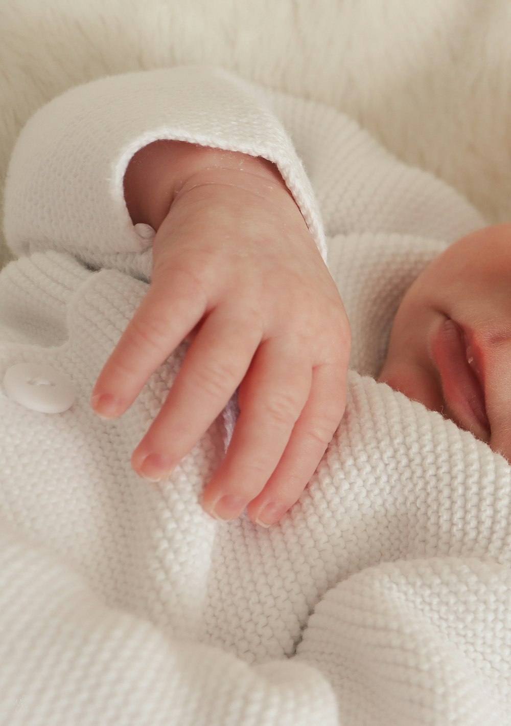 a close up of a person holding a baby