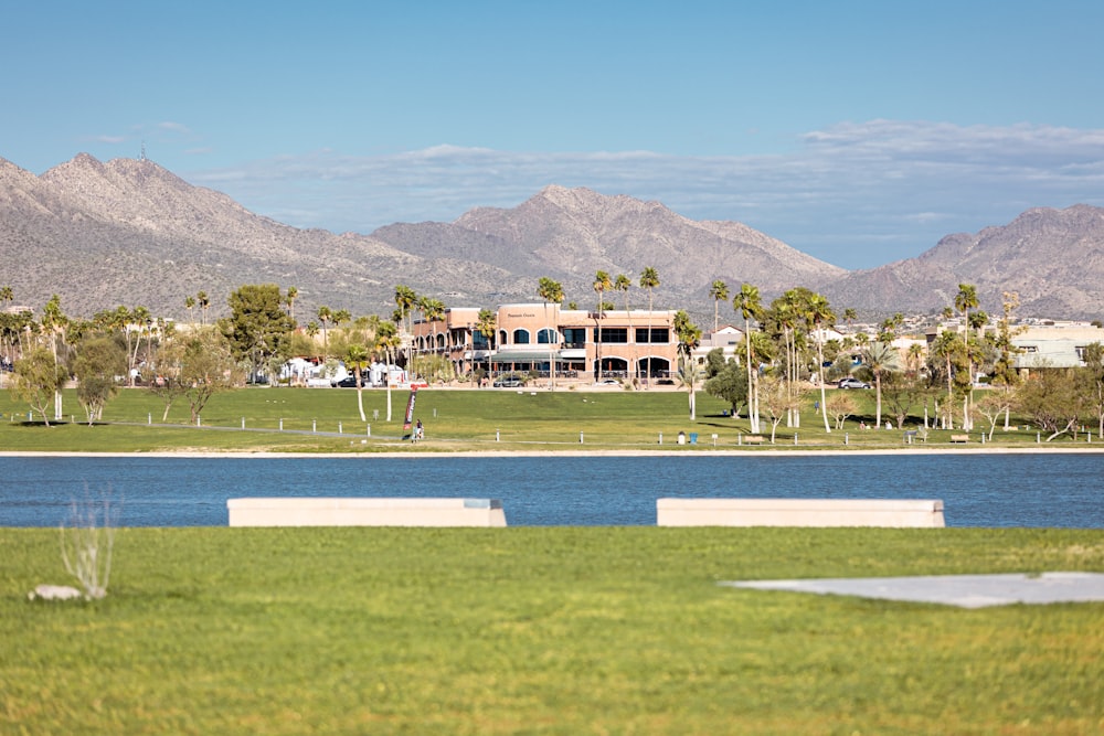 a view of a large building with mountains in the background