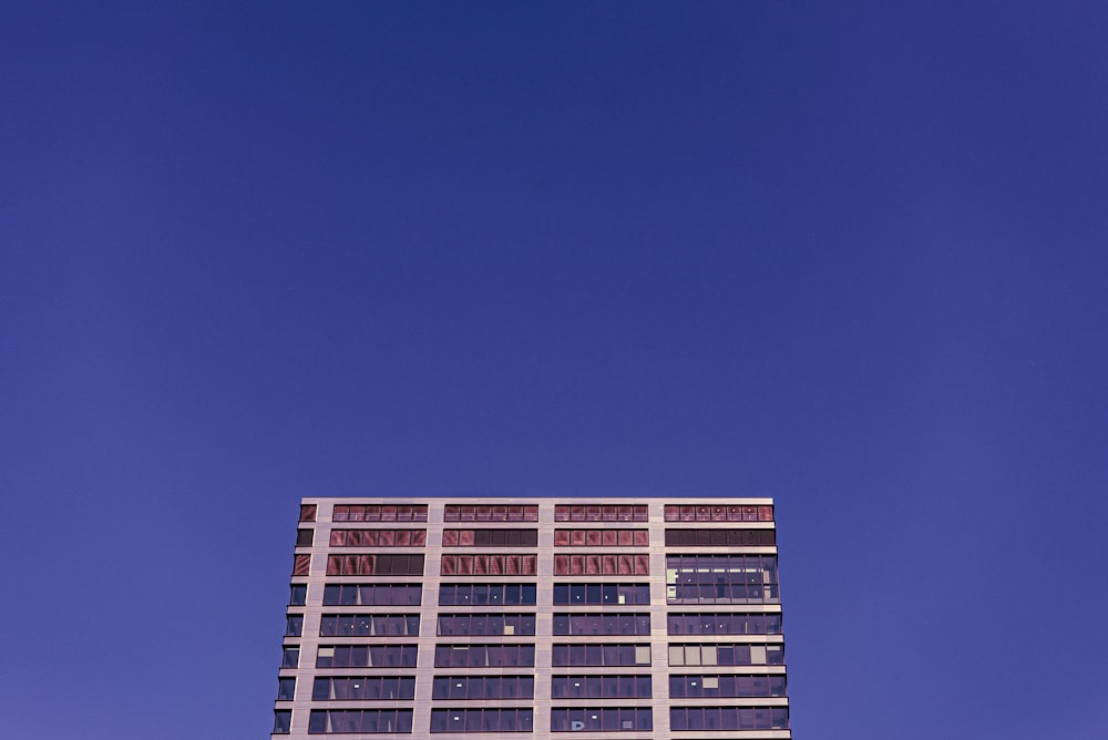 a tall building with a clock on the top of it