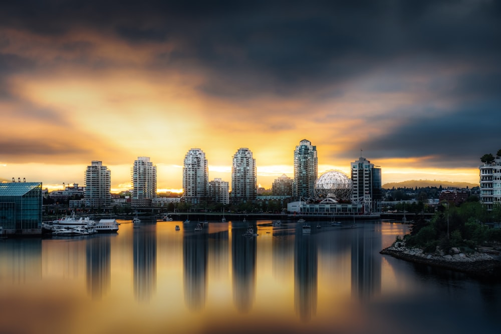 a large body of water with a city in the background