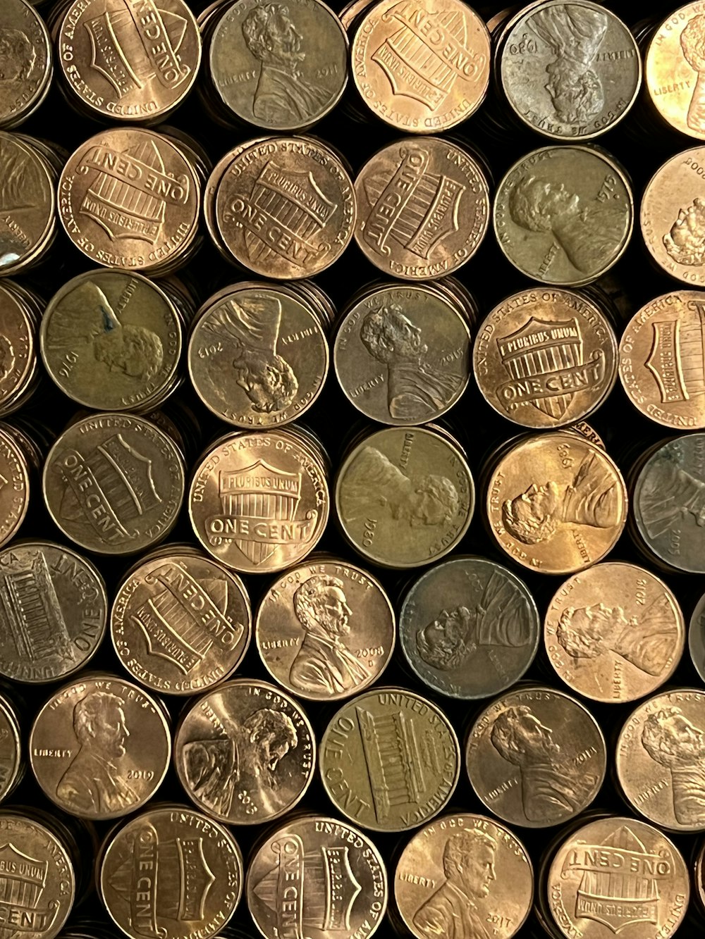 a pile of different types of coins