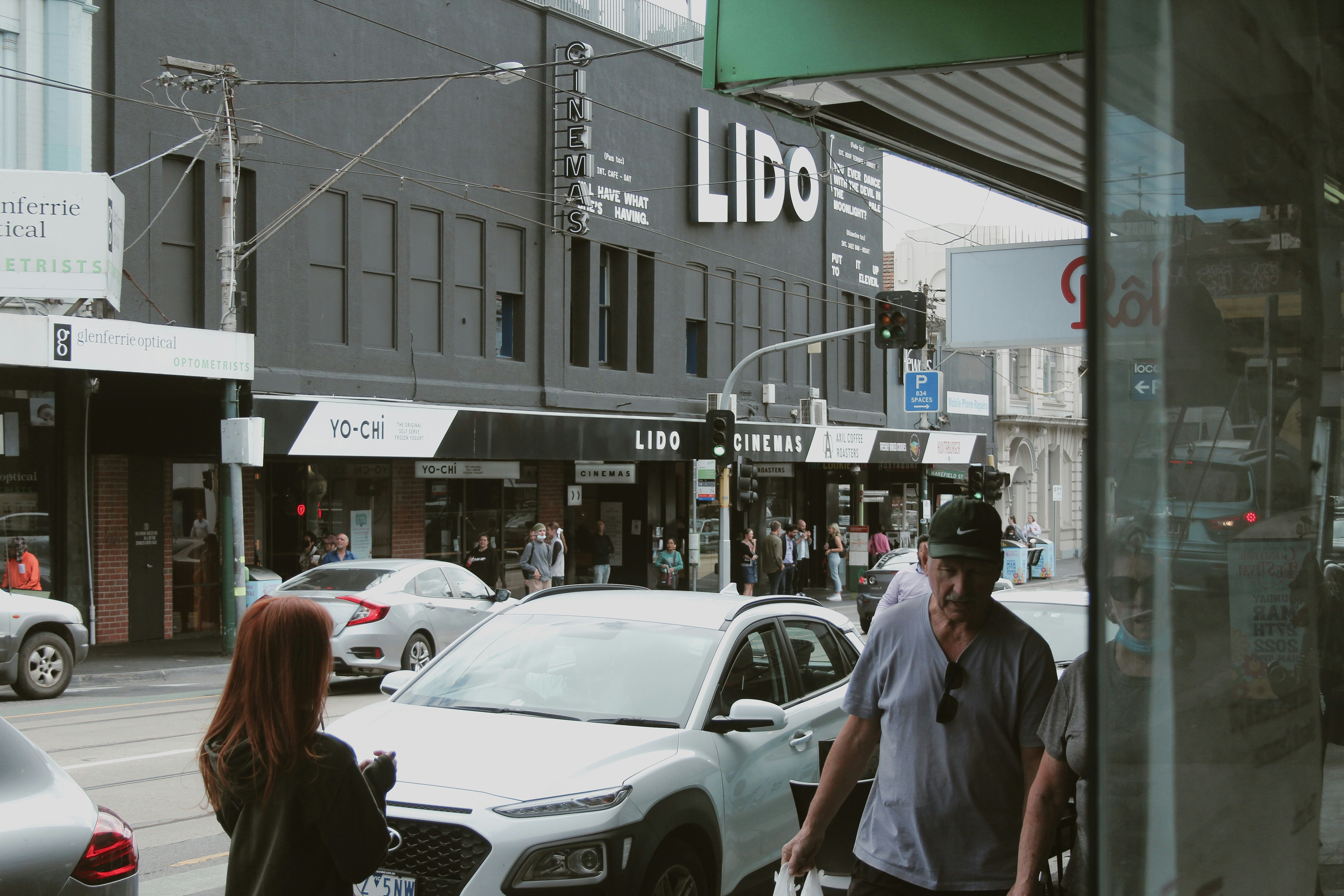 a man and a woman walking down a street