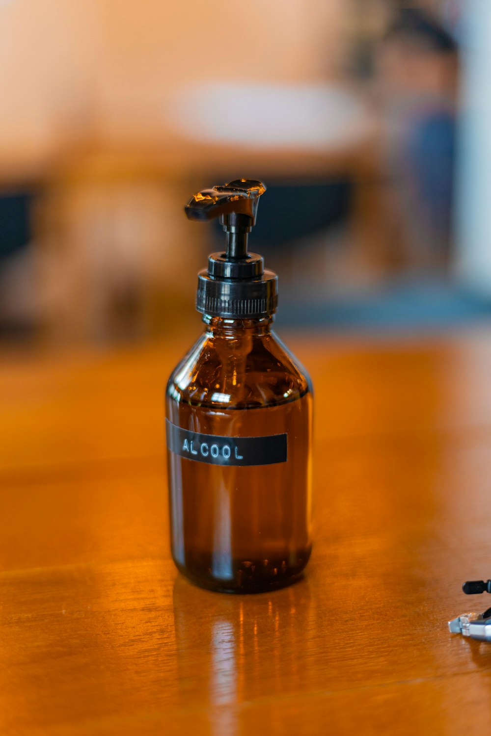 a bottle of alcohol sitting on top of a wooden table