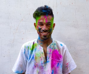 a man with colorful paint all over his face