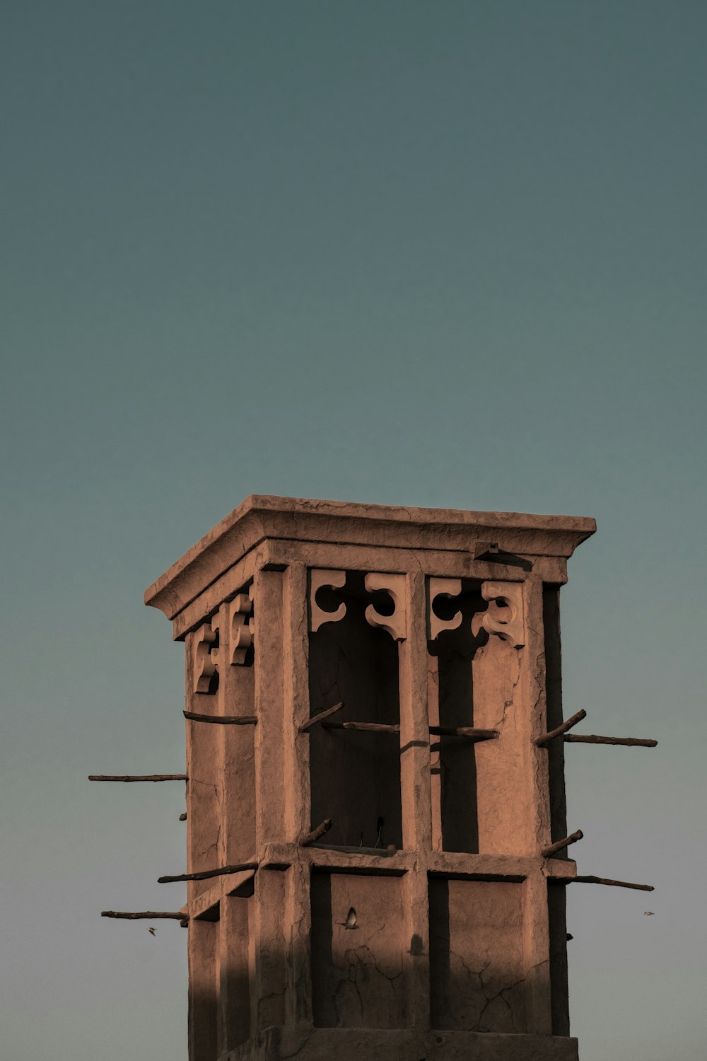 a tall tower with a clock on the top of it