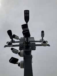a traffic light with multiple cameras attached to it