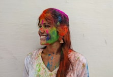 a woman with colorful paint all over her face