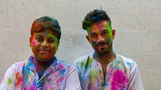 a couple of men standing next to each other