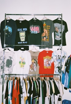 a rack with a variety of shirts hanging on it