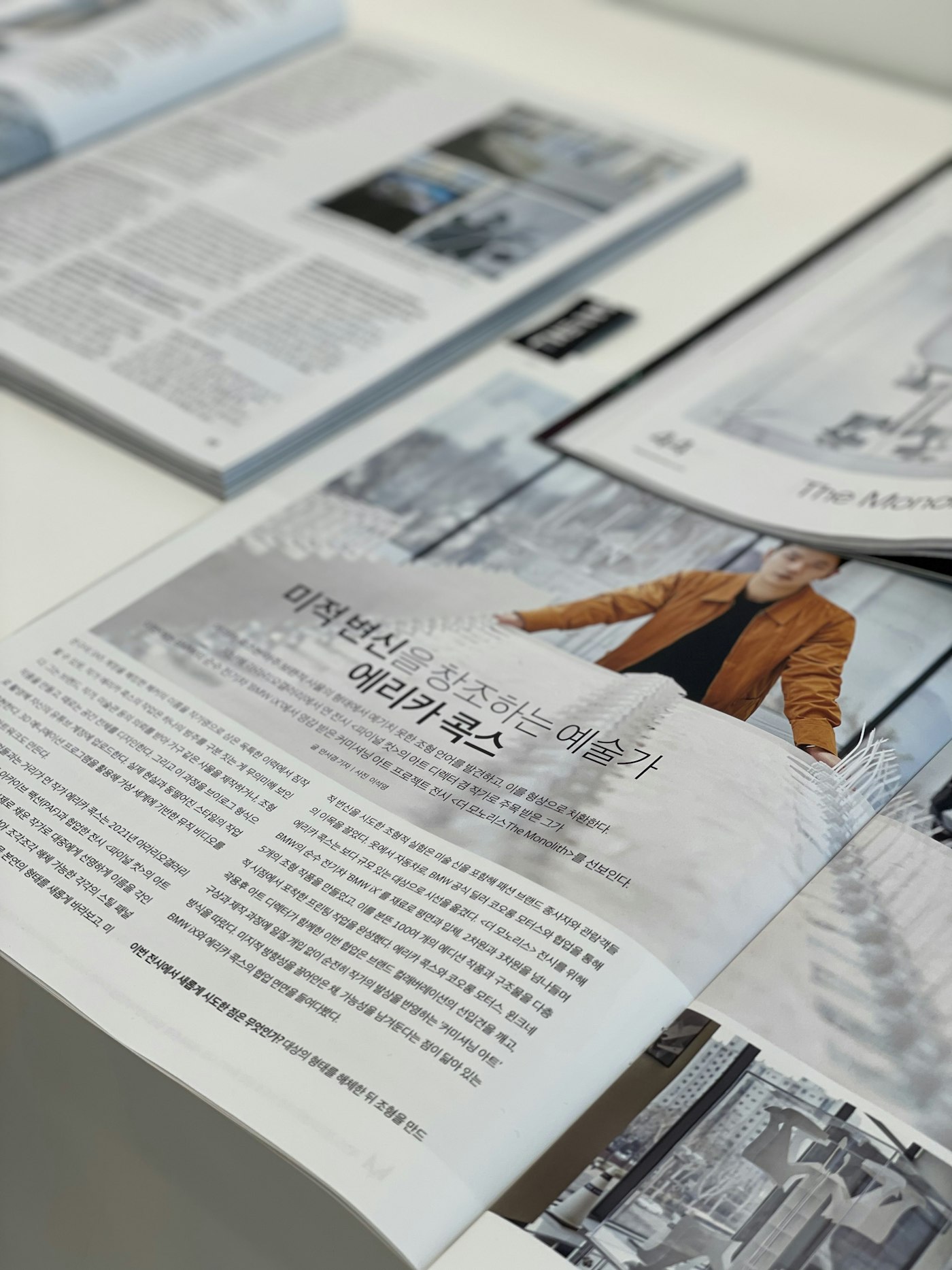 Open magazine spread with text and photos