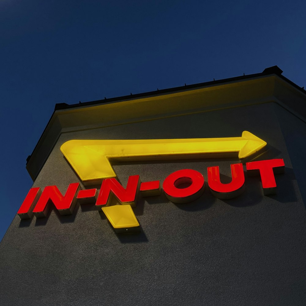 a sign on the side of a building that says in - n - out