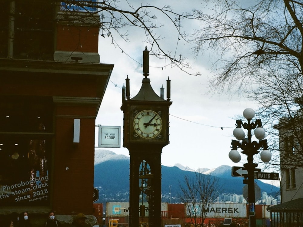 a clock tower in the middle of a city