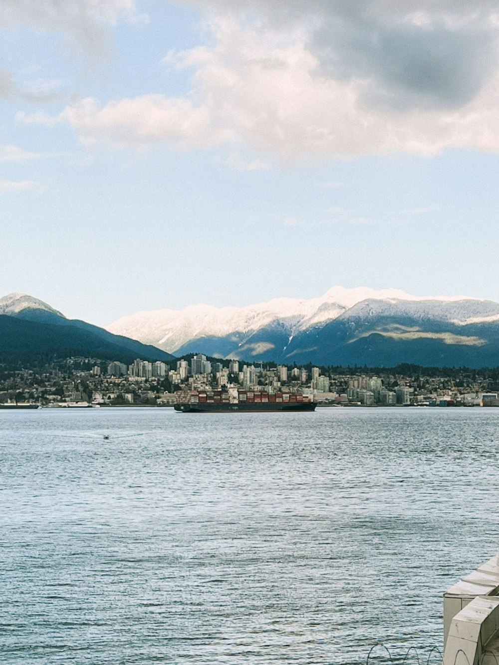 a view of a body of water with mountains in the background