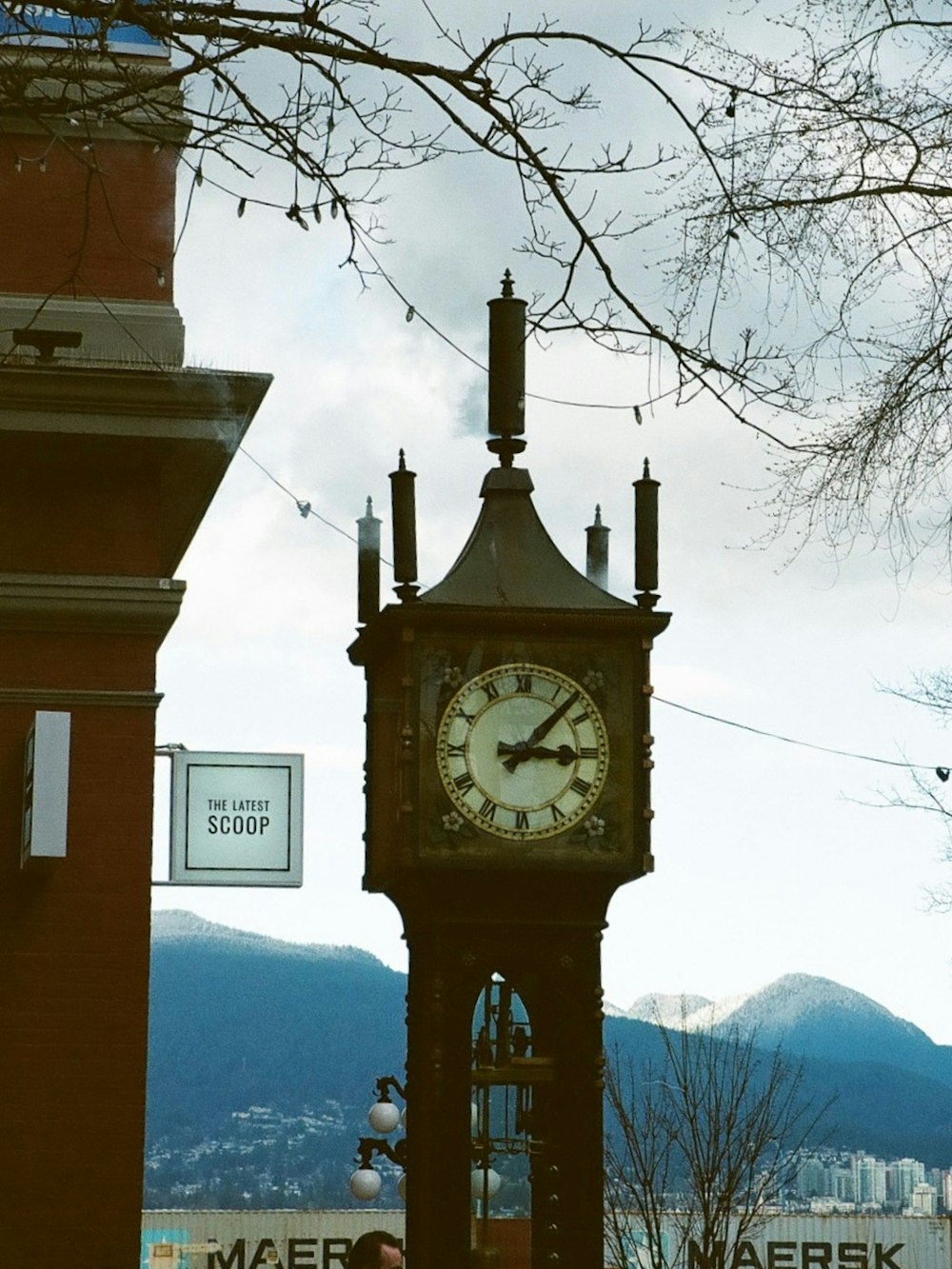 a tall clock tower with a clock on each of it's sides