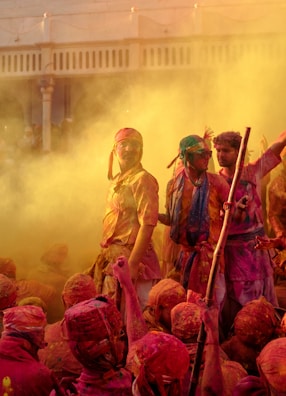 a group of people covered in colored powder