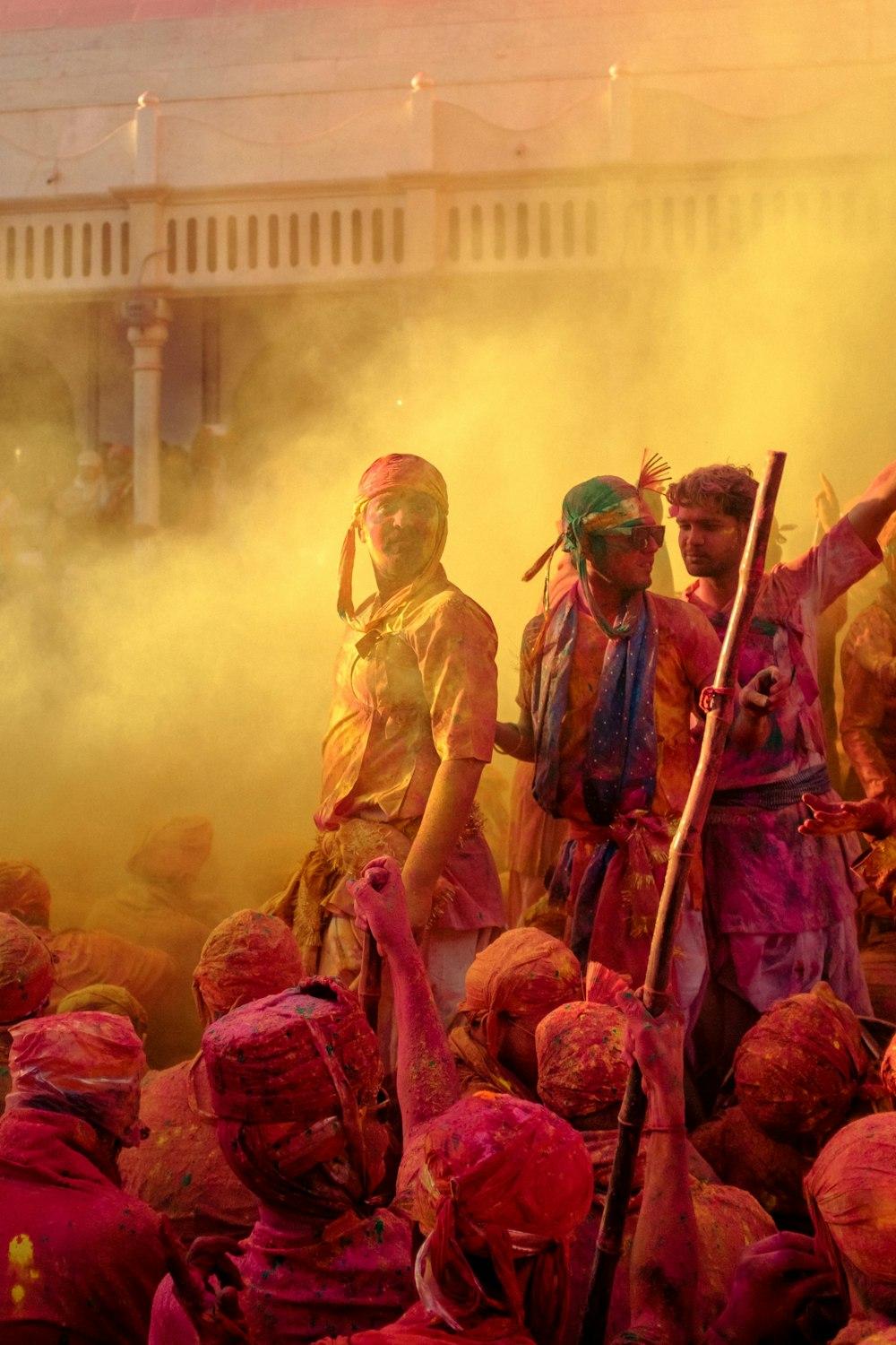 a group of people covered in colored powder