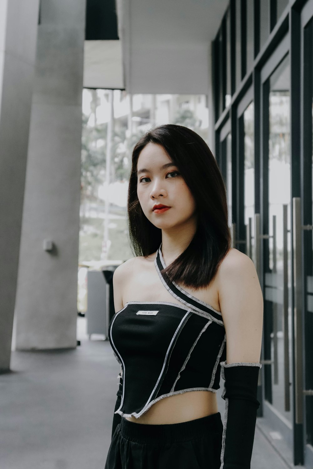 a woman standing in front of a building