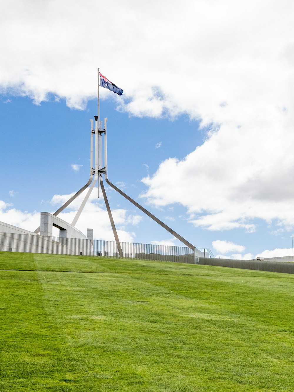 a flag is flying on top of a tall structure