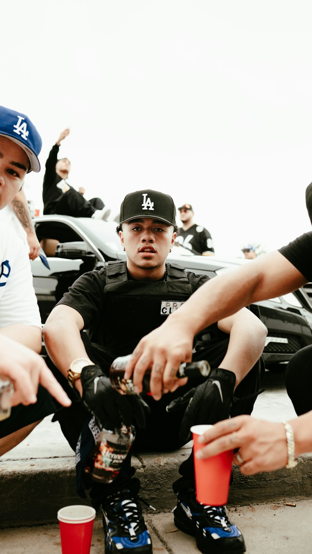 a group of young men sitting next to each other