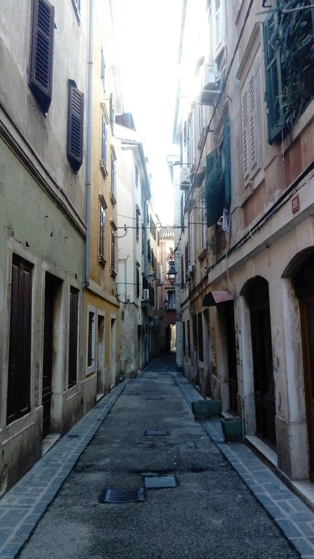a narrow alley way in an old city