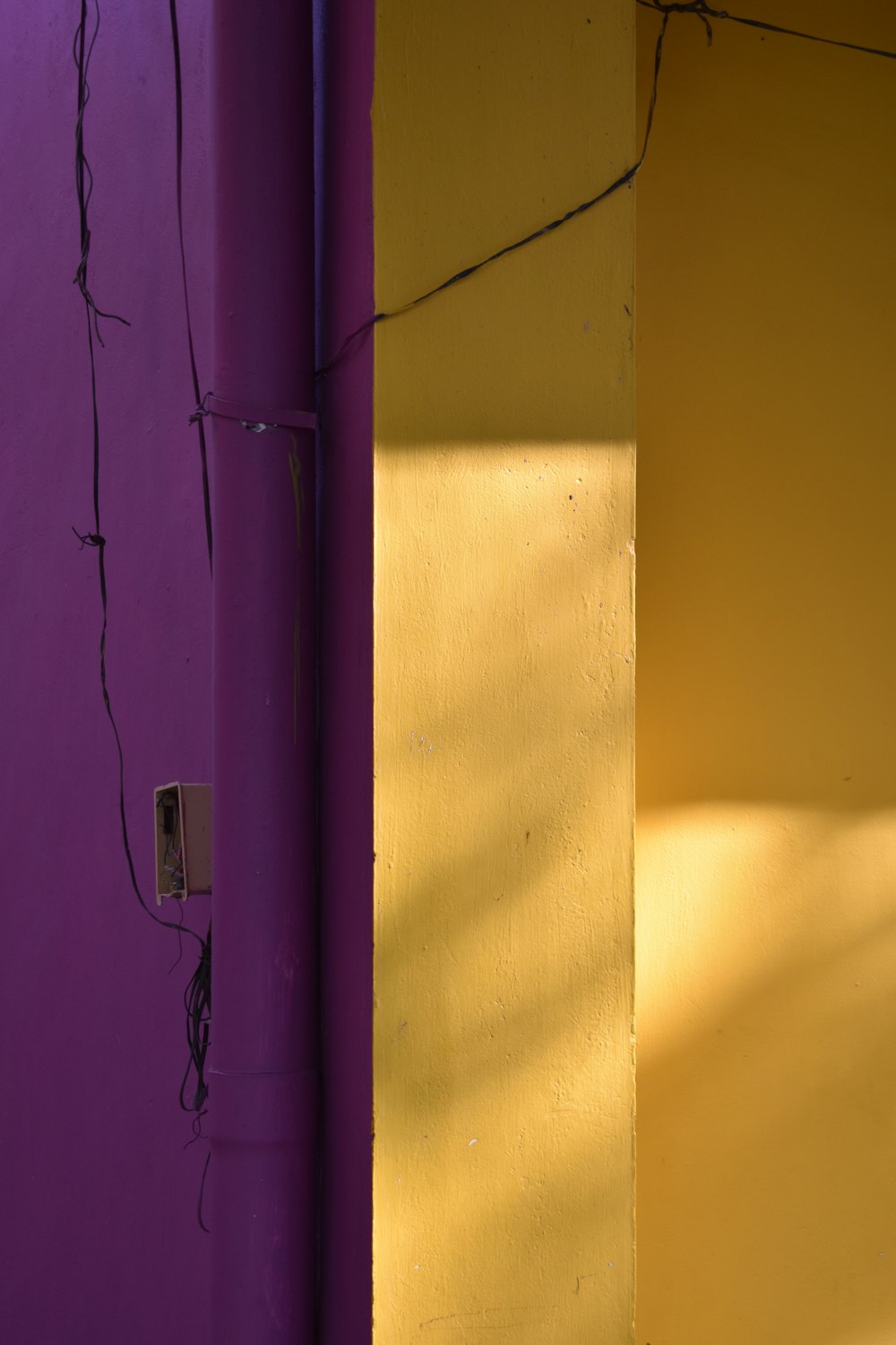 a yellow and purple wall next to each other