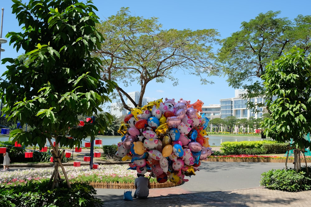 a large bunch of stuffed animals in a park