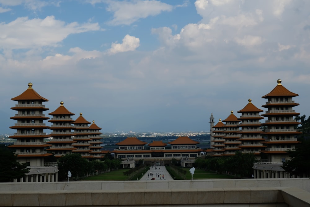 a group of buildings with a sky in the background