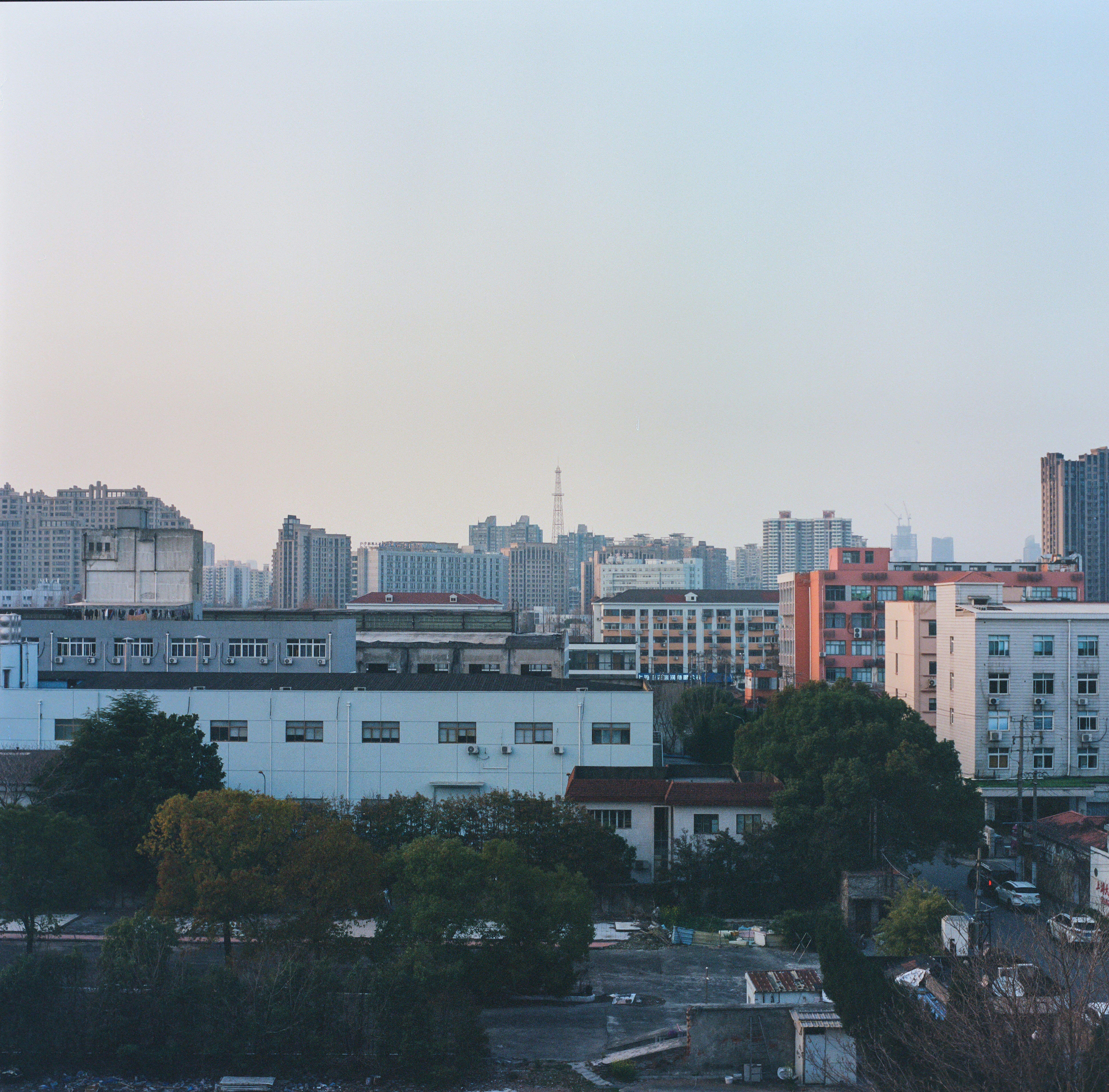 a view of a city with tall buildings