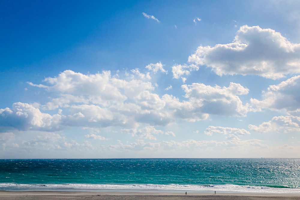 a view of the ocean from a sandy beach