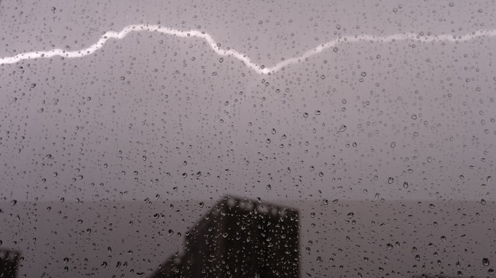 a lightning bolt is seen through a window