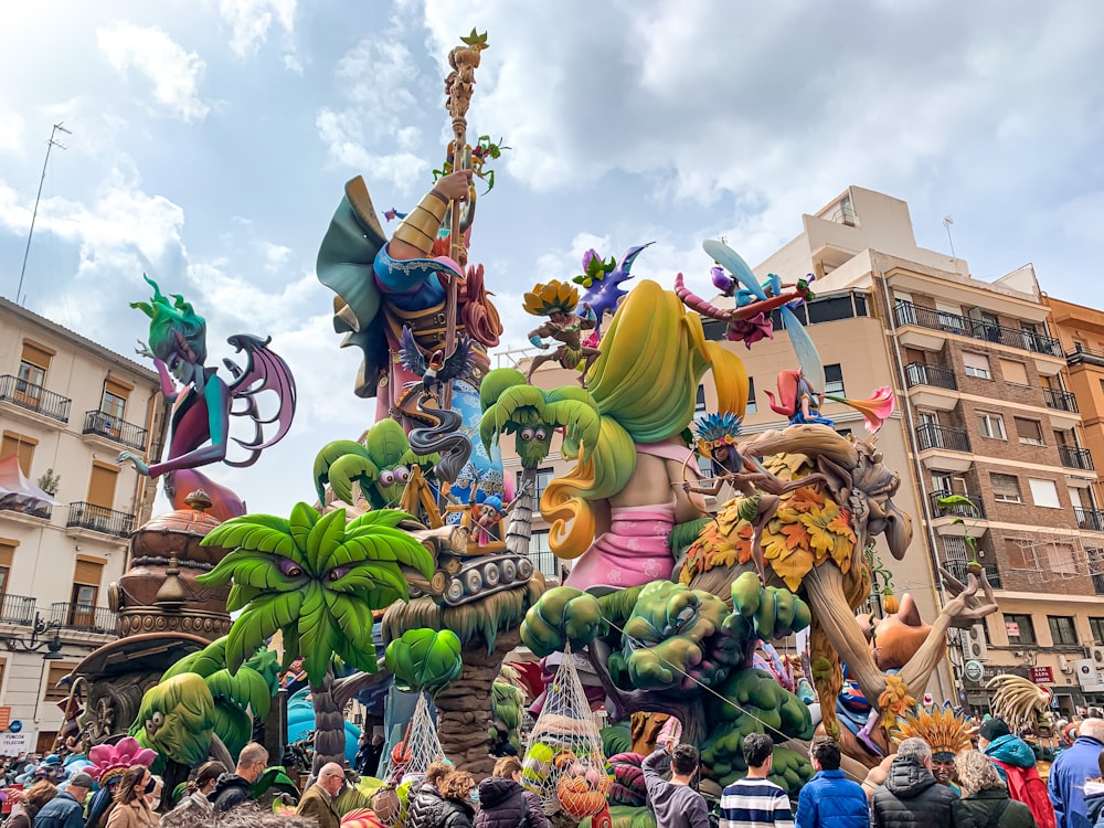 a group of people standing around a float in a parade