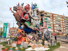 a large statue of a castle with lots of people around it