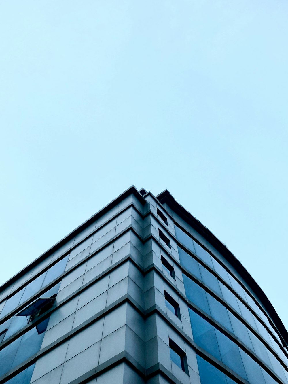 a very tall building with a sky in the background