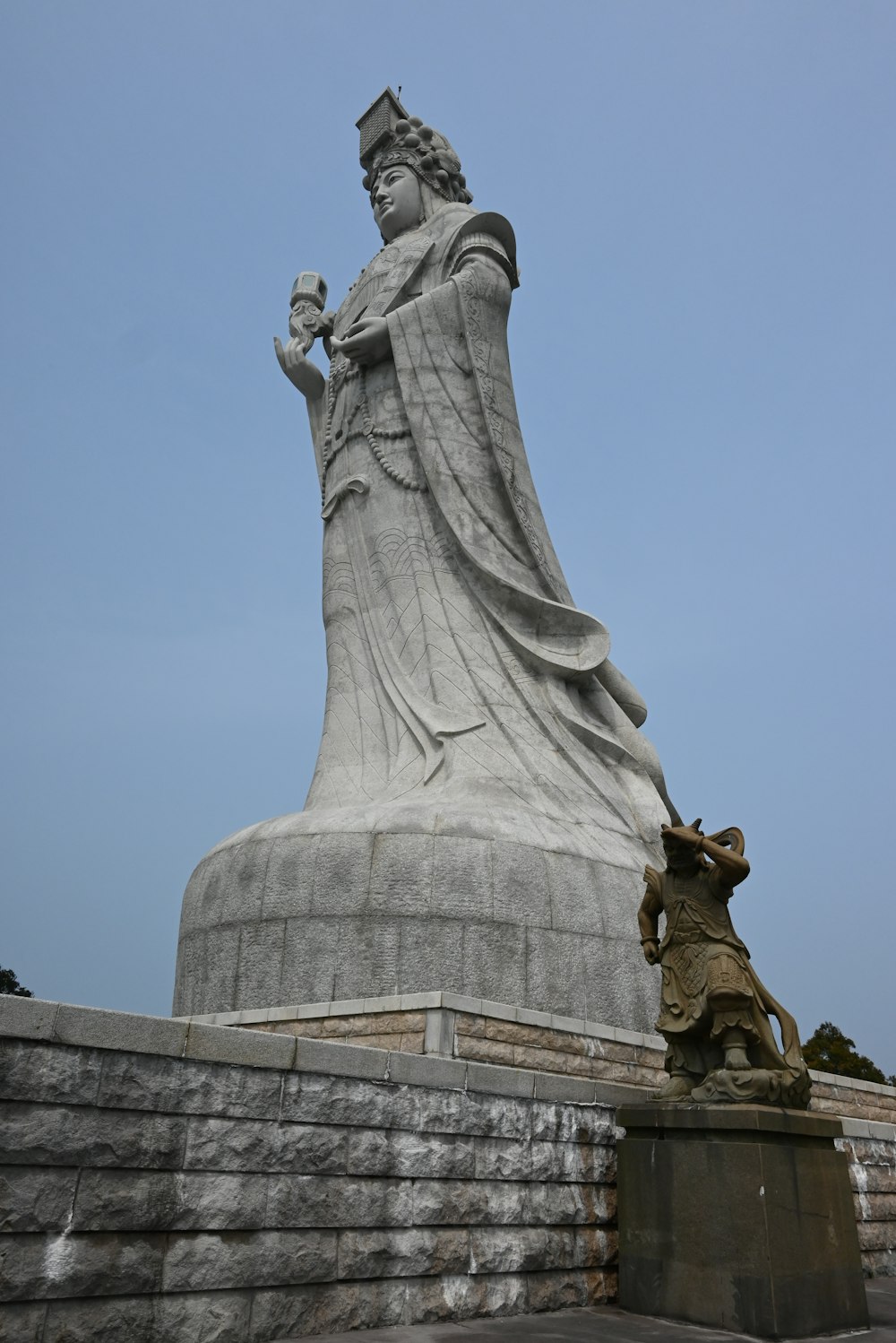 a large statue of a woman holding a baby