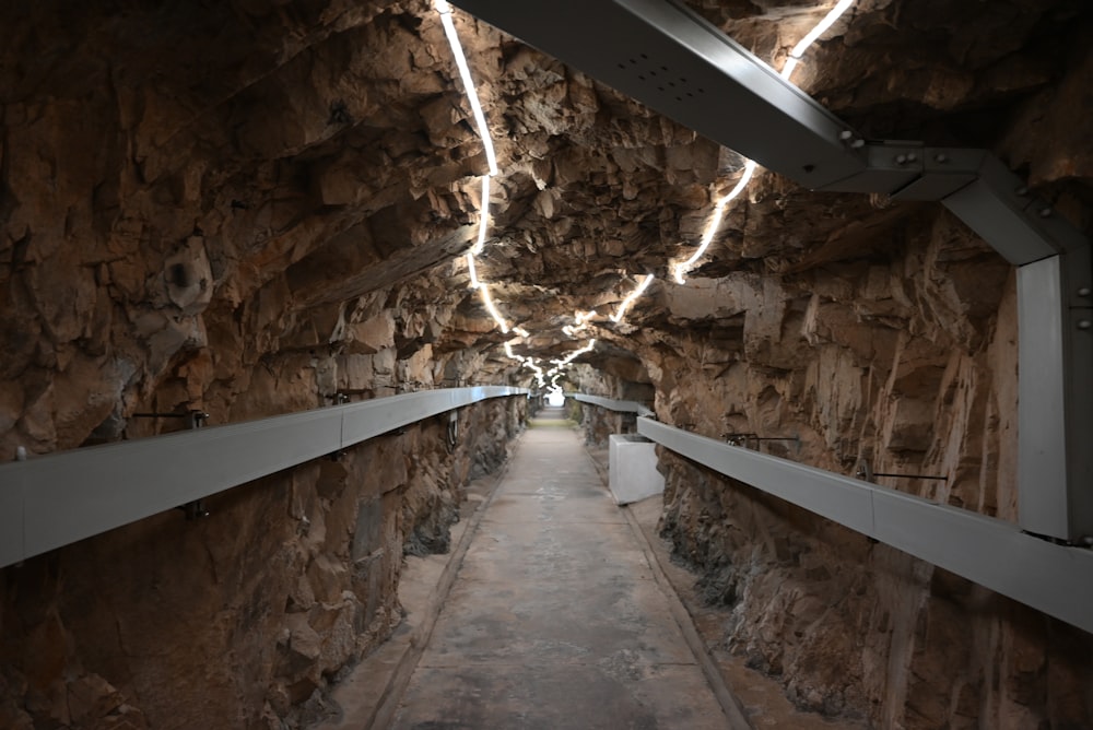 a long narrow tunnel with a light at the end