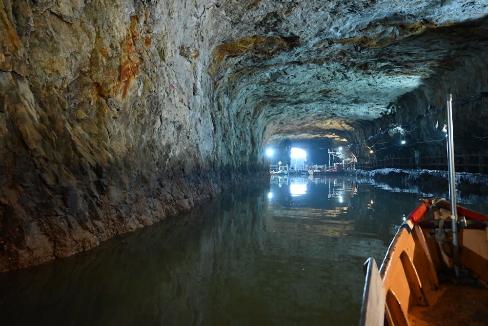 a boat is going through a cave filled with water