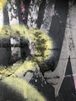 Abstract digital pattern featuring splattered pink paint over a bright yellow backdrop.