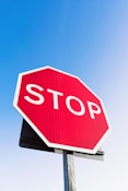 a stop sign with a blue sky in the background