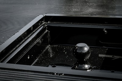 Close-up of sleek stainless steel panel with subtle reflections in a modern living room setting