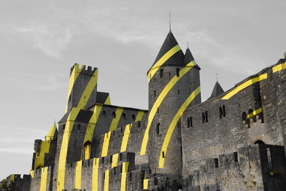 a castle with a yellow strip on the side of it