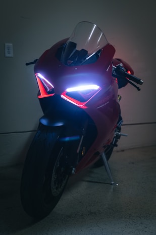 a close up of a motorcycle parked in a garage
