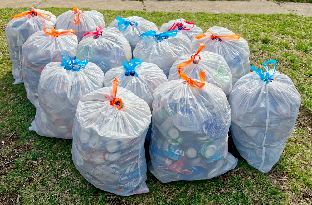 a group of plastic bags filled with garbage