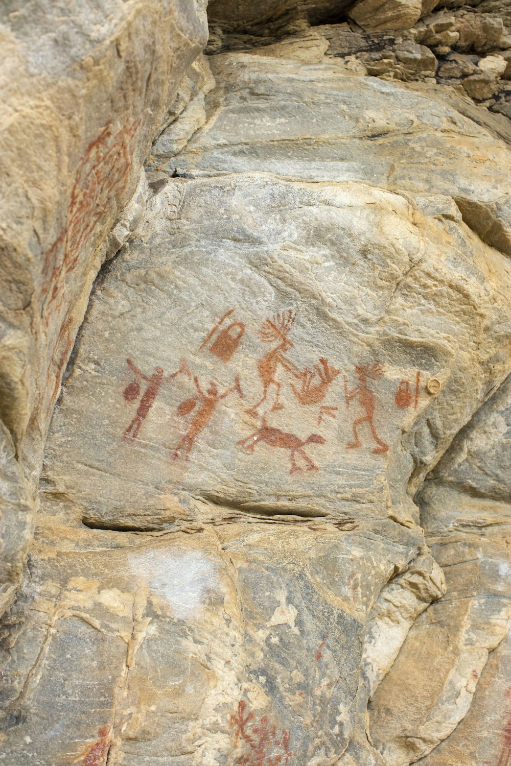 a rock with some paintings on it