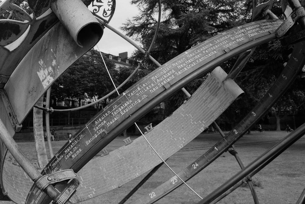 a black and white photo of a broken clock