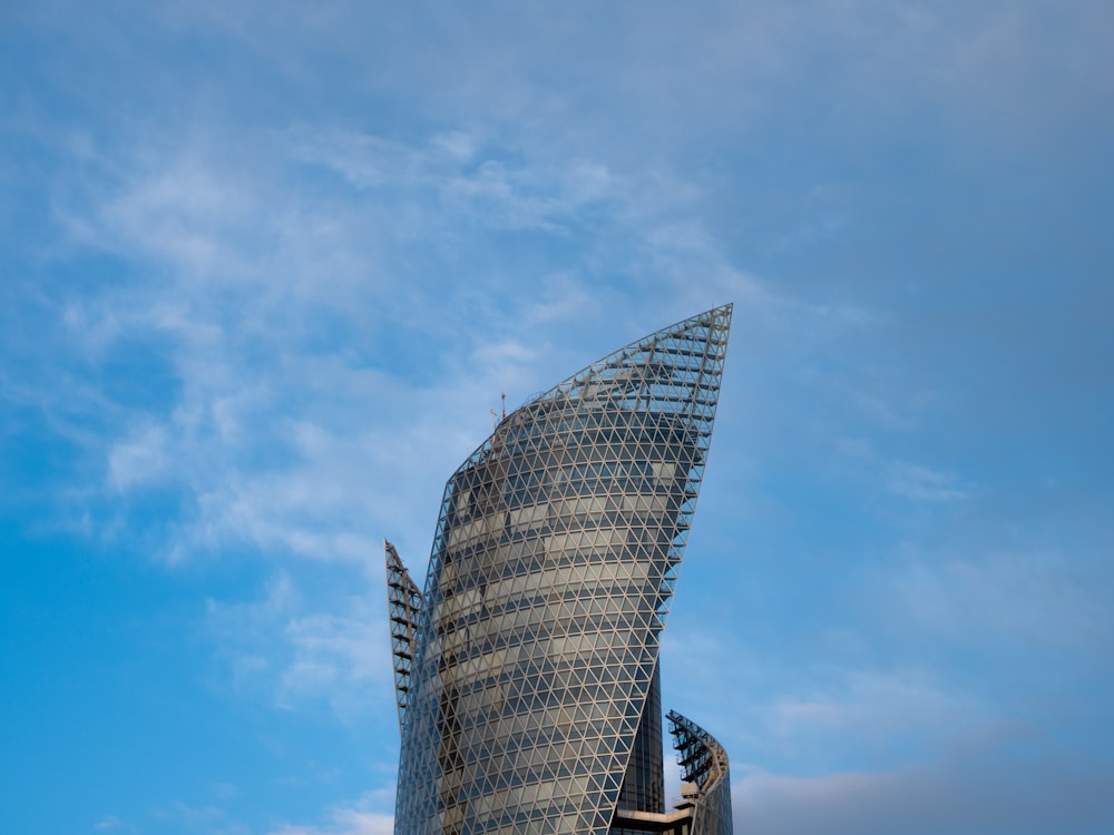 a very tall building with a curved roof