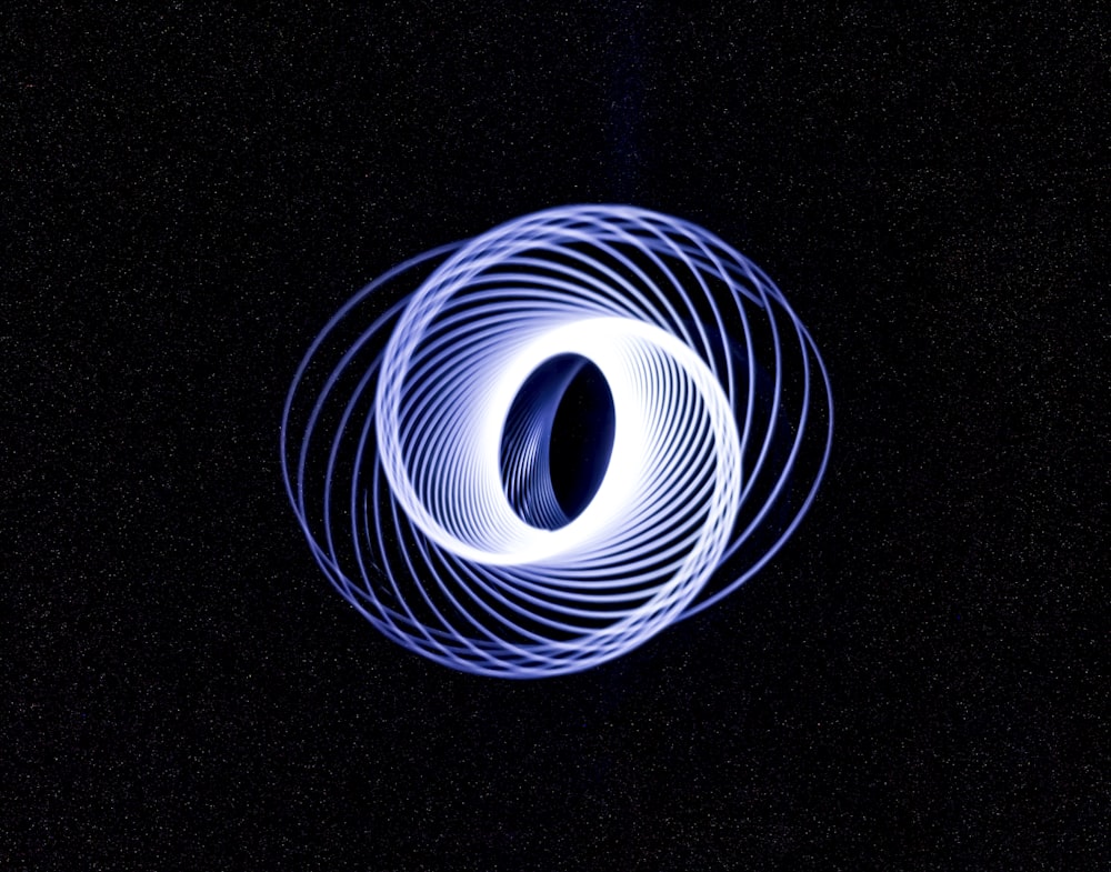 a circular object in the middle of a dark sky