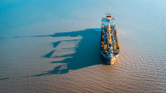 a large boat floating on top of a large body of water
