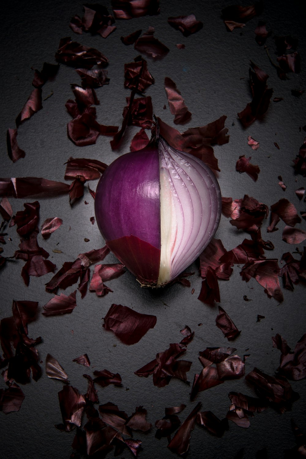 a red onion with a half eaten piece of it